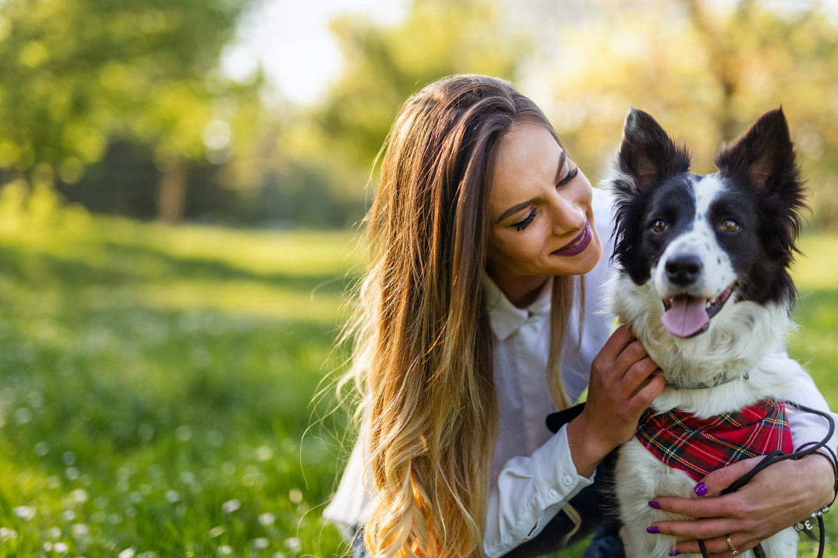 a-woman-and-her-dog-in-nature