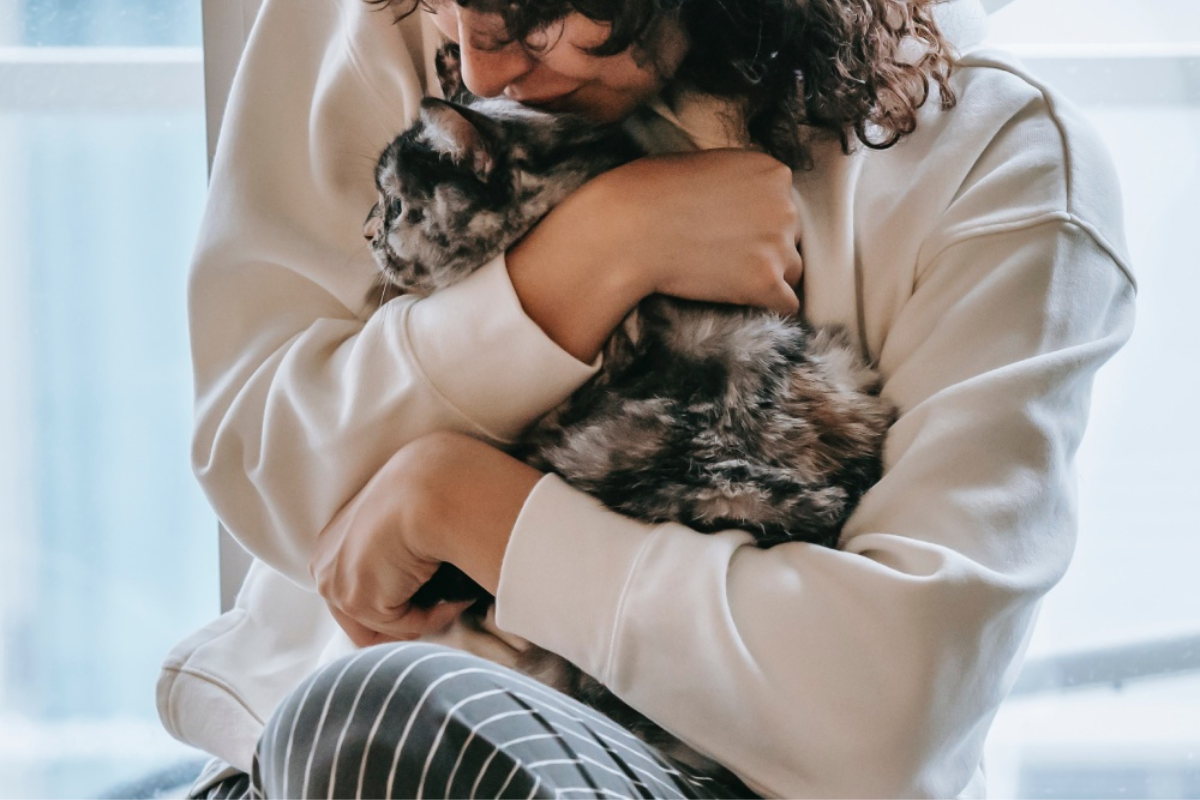 woman holding a cat